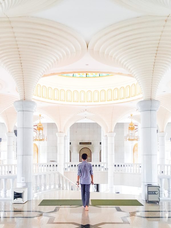 rear-view-man-standing-mosque